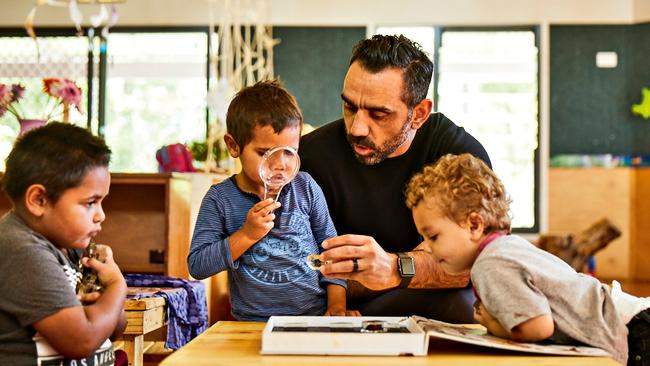 Adam Goodes with kids at the Girrawong preschool in Taree, part of the groundbreaking Australian Literacy and Numeracy Foundation project. Picture: James Green