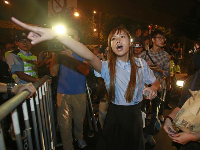 Newly-elected Hong Kong politician Yau Wai-ching shouts at police during the clashes. Picture: Kin Cheung/AP