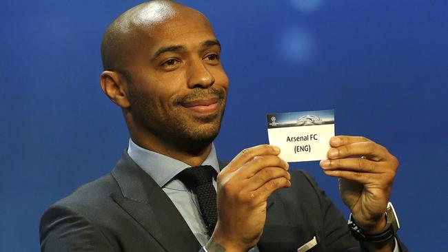 Former player Thierry Henry shows the name of Arsenal FC, who will play in Group A.