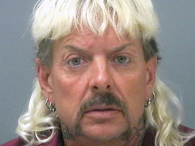 FILE - This file photo provided by the Santa Rosa County Jail in Milton, Fla., shows Joseph Maldonado-Passage, also known as "Joe Exotic." Maldonado-Passage was convicted in an unsuccessful murder-for-hire plot against Carole Baskin, the founder of Big Cat Rescue, who he has repeatedly accused of killing her husband Jack â€œDonâ€ Lewis. Lewis' unsolved 1997 disappearance and Maldonado-Passage's accusations are the subject of new Netflix series â€œTiger King.â€ (Santa Rosa County Jail via AP, File)