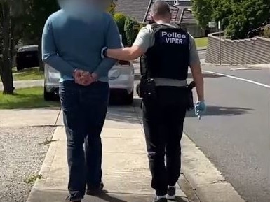 Police arrest “Chicken Man” outside his home. Picture: Victoria Police