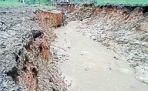 The bank of Rothman Road has been washed away after recent rain. Picture: Tracy Knight