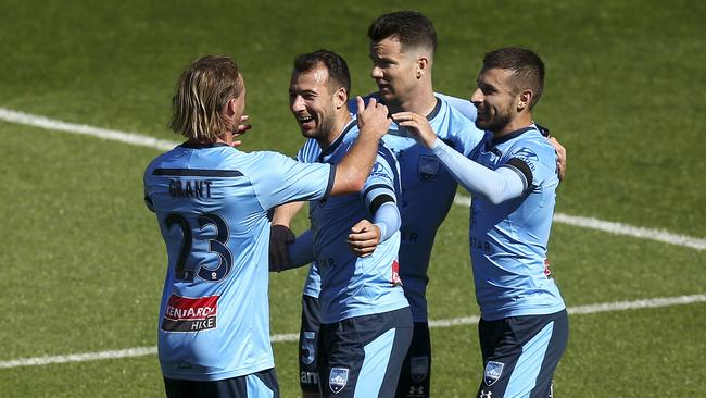 Sydney FC striker Adam le Fondre celebrates with Rhyan Grant, Alexander Baumjohann and Kosta Barbarouses after scoring against Wellington. Picture: Getty Images