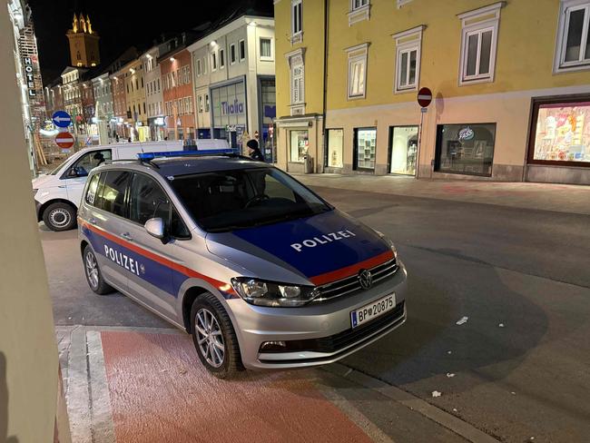 Police are seen after a knife attack near the main square in the city centre of Villach, southern Austria. Picture: AFP