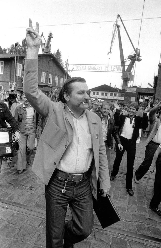 Lech Walesa leader of Solidarity trade union is cheered by fellow workers as he leaves the Lenin Shipyards in Gdansk, Poland, in June 1983.