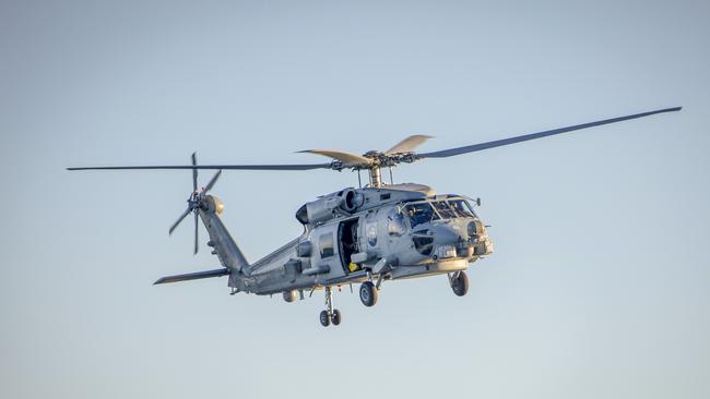 HMAS Ballarat's embarked MH-60R helicopter takes flight as the ship transits up the Western Australian coast.