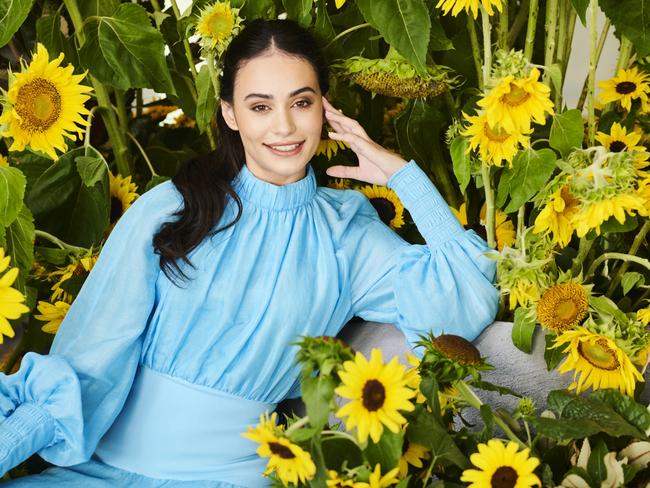 Model Bonnie Jackson amongst an installation of 3000 sunflowers at the National Gallery of Australia as part of the launch of their new exhibition Botticelli to Van Gogh. 2  March 2021. Photo: Rohan Thomson