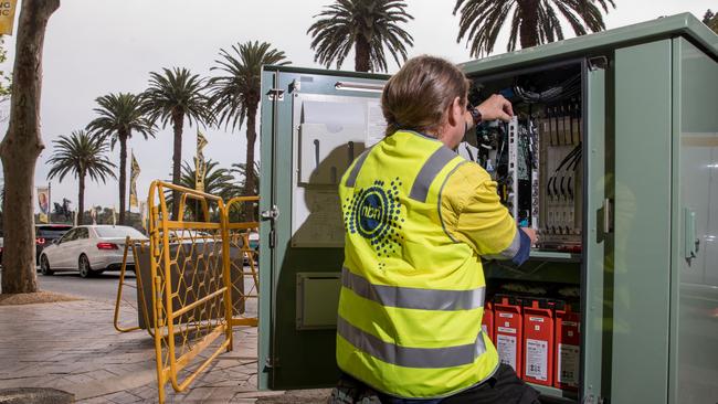 An NBN Co. technician working on a fibre distribution cabinet. Picture: Cole Bennetts/Bloomberg