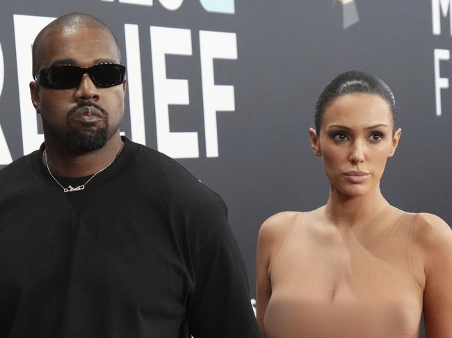 EDS NOTE: NUDITY - Kanye West, left, and Bianca Censori arrive at the 67th annual Grammy Awards on Sunday, Feb. 2, 2025, in Los Angeles. (Photo by Jordan Strauss/Invision/AP)