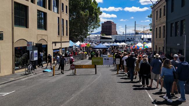 Queues wind up streets and walkways at all four entrances to Salamanca Market. Picture: ANNIE MCCANN.