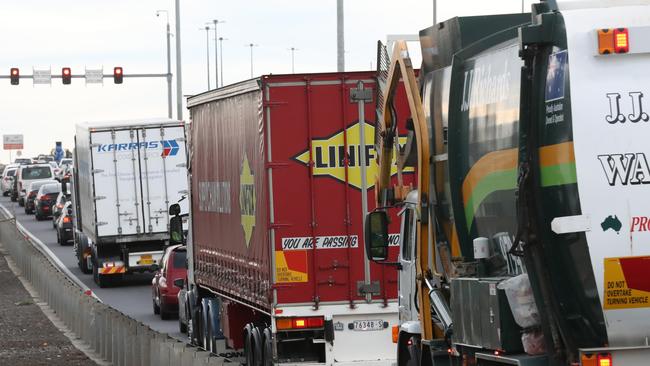 Trucks line up to get onto the Westgate freeway on the ramp off Williamstown rd in Yarraville Picture: David Crosling