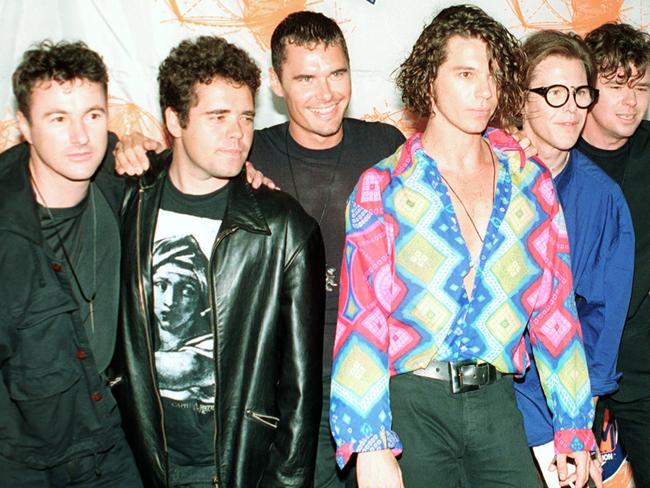 Members of the Australian rock group INXS pose at the 7th annual American MTV Video Music Awards at Universal Ampitheater in Universal City, Ca., on Sept. 6, 1990.  The band members are, Tim Farriss, Kirk Pengilly, Michael Hutchence, Jon Farriss, Garry Beers and Andrew Farriss.  (AP Photo/Kevork Djansezian)