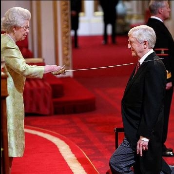 Michael Parkinson was knighted by the Queen in 2008. Picture: AFP