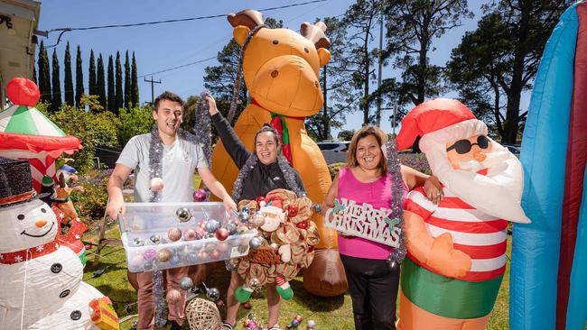 Chandlar Eliezer, Edna Mahina and Tanya Sutterby are forging ahead with their Christmas lights display in The Boulevard in Ivanhoe. Picture: Jason Edwards