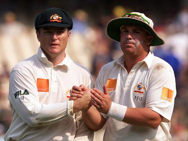 Stuart MacGill and Shane Warne during a Test match against South Africa in 2002. Picture: Brett Costello