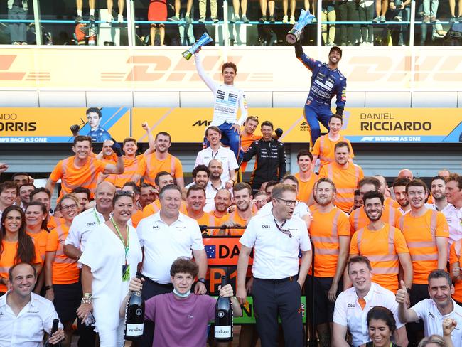 Race winner Daniel Ricciardo of Australia and McLaren F1 and second placed Lando Norris of Great Britain and McLaren F1 celebrate with their team after the F1 Grand Prix of Italy. Picture: Bryn Lennon/Getty Images