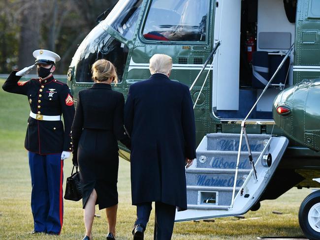 Former President Donald Trump and wife Melania ready to board Marine&gt; Picture: AFP