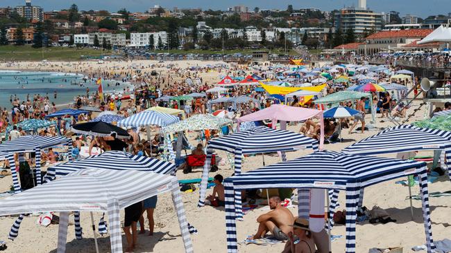 Crowds flocked to Bondi Beach as temperatures climbed on Monday. Picture by Max Mason-Hubers