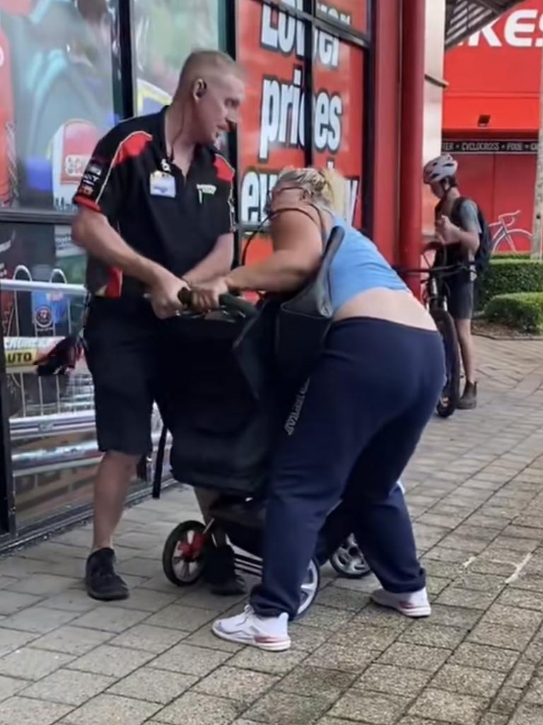 The staff member tried to grab the pram from the woman. Picture: TikTok