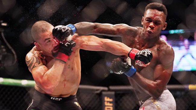 Robert Whittaker is hit by Israel Adesanya during UFC 243 at Marvel Stadium in October