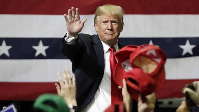 Donald Trump acknowledges the crowd as he leaves a rally in Chattanooga. Picture; AFP.