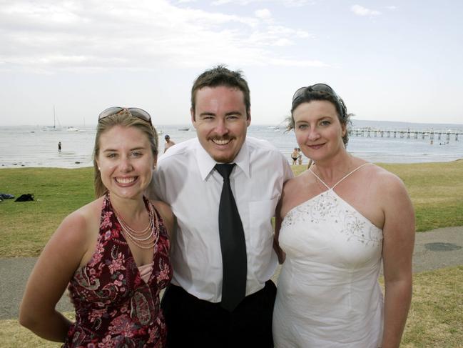 Sally Woddington, 24, and Warrick Nicolson, 25, travelled from Sydney and Steph Lacey came from London to celebrate New Year's Eve at Sorrento. Picture: Andrew Maccoll