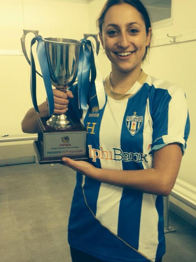 Holding the 2014 women’s state league Premier Cup playing for West Adelaide.