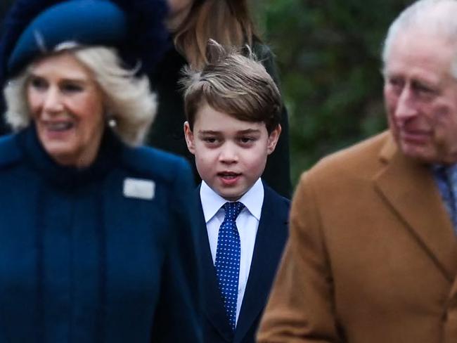 Prince George walks behind Queen Camilla and King Charles at last year’s Sandringham church service. Picture: AFP