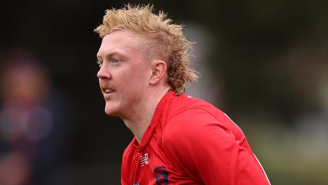 MELBOURNE, AUSTRALIA - APRIL 10: Clayton Oliver of the Demons handballs during a Melbourne Demons AFL training session at Gosch's Paddock on April 10, 2024 in Melbourne, Australia. (Photo by Robert Cianflone/Getty Images)