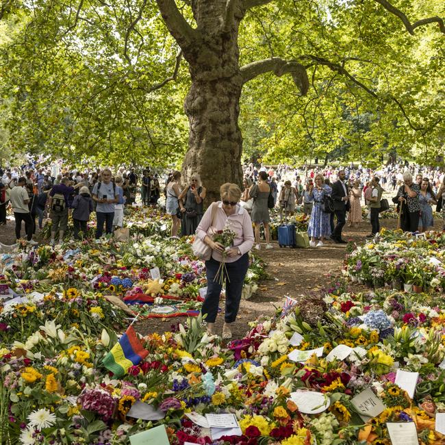 Members of the public lay flowers to honour Queen Elizabeth II in Green Park in London. Picture: Getty Images