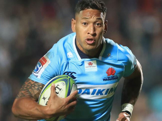 SYDNEY, AUSTRALIA - MAY 05: Israel Folau of the Waratahs breaks free from the tackle of Orbyn Leger of the Blues during the round 12 Super Rugby match between the Waratahs and the Blues at Lottoland on May 5, 2018 in Sydney, Australia.  (Photo by Mark Evans/Getty Images)