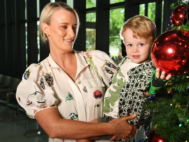 Kimberley McNamara with her son Freddy, 2, help to welcome the Christmas cheer at Townsville University Hospital. Picture: Shae Beplate.