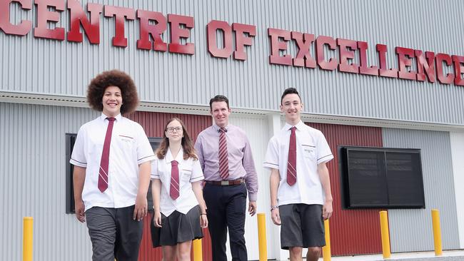 Principal Andrew Peach with students Caleb Jack, Amy Algie and Calarn Jackson at Marsden State High School, which was in the running to be named Queensland’s best state school. AAP/Jono Searle