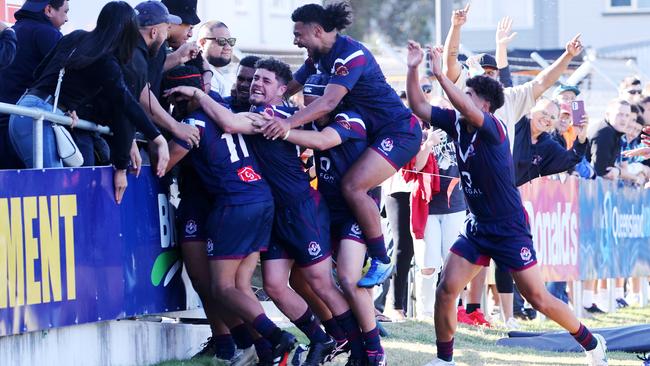 Ipswich SHS player Josiah Pahulu celebrates with teammates after that try. Picture: NIGEL HALLETT