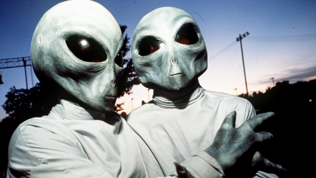 Aliens and UFO have captured popular interest for decades such as this couple who dressed up for the 1996 UFO Festival in Roswell aug 1996. USA festivals o/seas