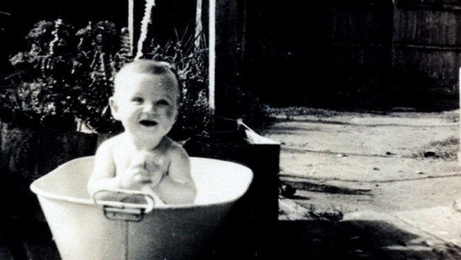 Mr Hawke as a baby in a tin bath in the backyard of his Bordertown home. Hawke Family Archive.