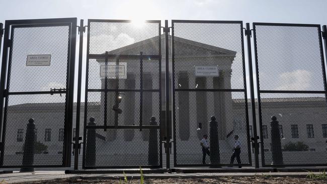 The US Supreme Court Building is barricaded in anticipation of unrest following the ruling. Picture: AFP.