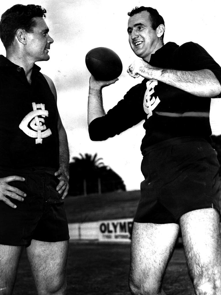 Ridgway showing Carlton coach Ron Barassi how to play football the American way.