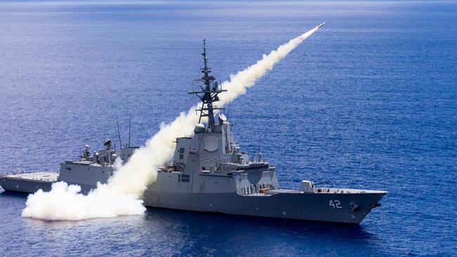 Adelaide-built guided missile destroyer HMAS Sydney fires a Harpoon surface to surface missile.