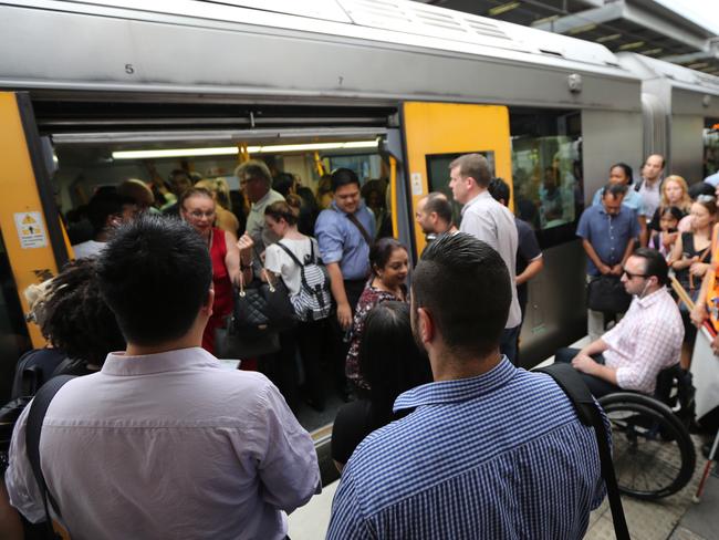 A man in a wheelchair awaits to get on a train at Central. Pic: John Grainger