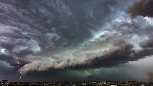 Lightning strikes as storms roll in over Melbourne. Picture: Steven English