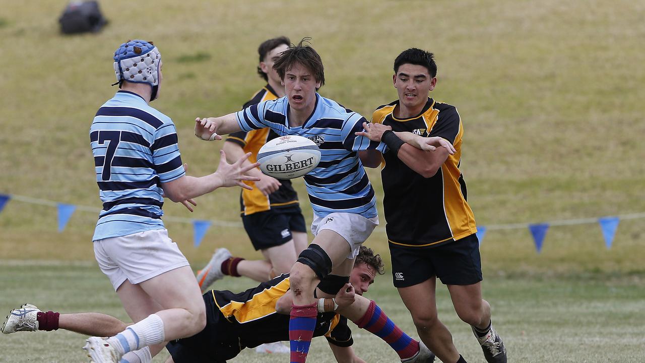 GPS2's Austin Durbidge gets the ball away to teammate Darcy Fogarty in recent trials. .