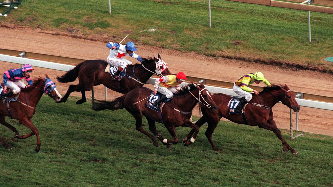 Arctic Scent, ridden by jockey Brent Stanley, winning the 1996 Caulfield Cup.