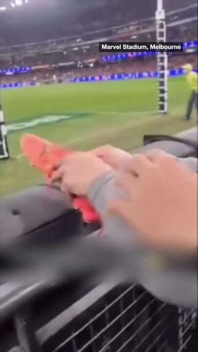 Fans save AFL player by untying his lost shoes' laces