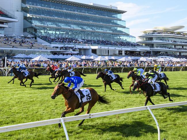 MELBOURNE, AUSTRALIA - MARCH 11: Dean Holland riding In Secret defeats Lofty Strike and I Wish I Win in Race 7, the Yulong Stud Newmarket Handicap,  during Melbourne Racing at Flemington Racecourse on March 11, 2023 in Melbourne, Australia. (Photo by Vince Caligiuri/Getty Images)