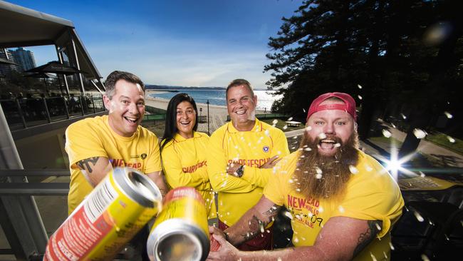 Darren Magin, left, and Jimmy Herron, right, crack open Nineteen 09 with surf lifesavers Julianna Grana and David Fuller. Picture: Nigel Hallett