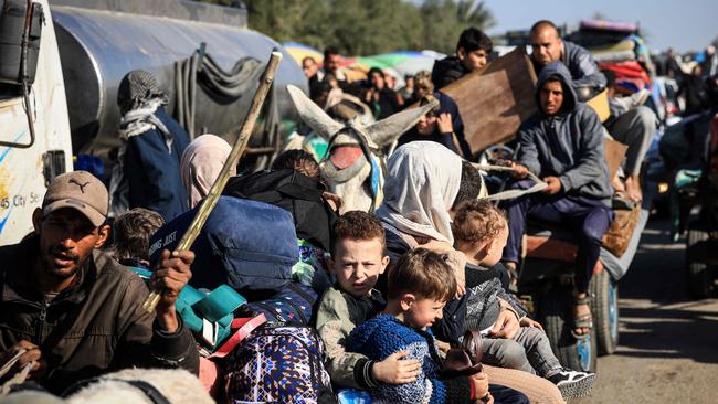 Palestinian families flee the Gazan city of Khan Younis on Monday. Picture: AFP