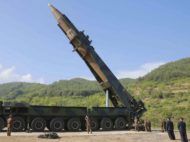 Kim Jong-un, second from right, inspects the preparation of the launch of a Hwasong-14 intercontinental ballistic missile in July. Picture: KCNA/KNS/AP