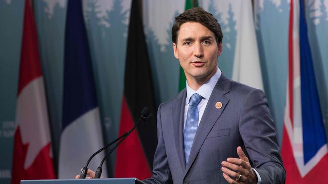 Canadian Prime Minister Justin Trudeau addresses a press conference at the conclusion of the G7 summit in La Malbaie, Quebec, June 9, 2018.  / AFP PHOTO / Lars Hagberg