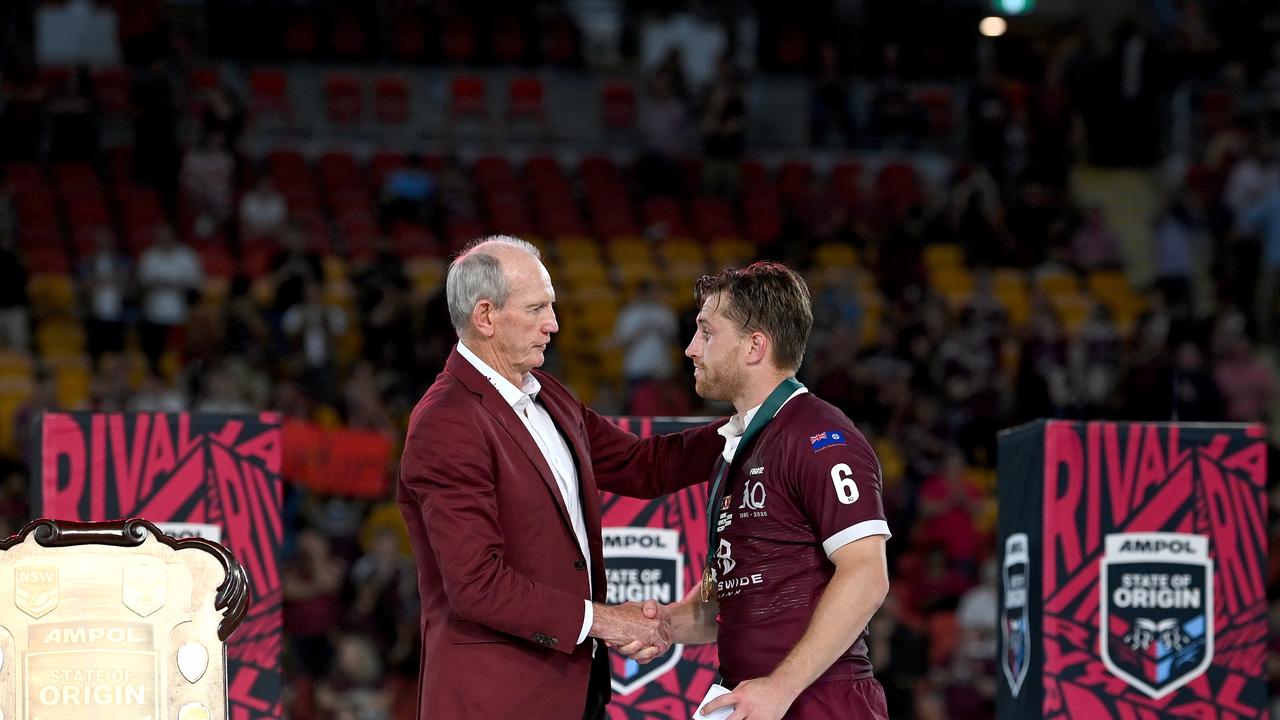 BRISBANE, AUSTRALIA - NOVEMBER 18: Cameron Munster of the Maroons is presented with the man of the match award by Maroons coach Wayne Bennett after game three of the State of Origin series between the Queensland Maroons and the New South Wales Blues at Suncorp Stadium on November 18, 2020 in Brisbane, Australia. (Photo by Bradley Kanaris/Getty Images)